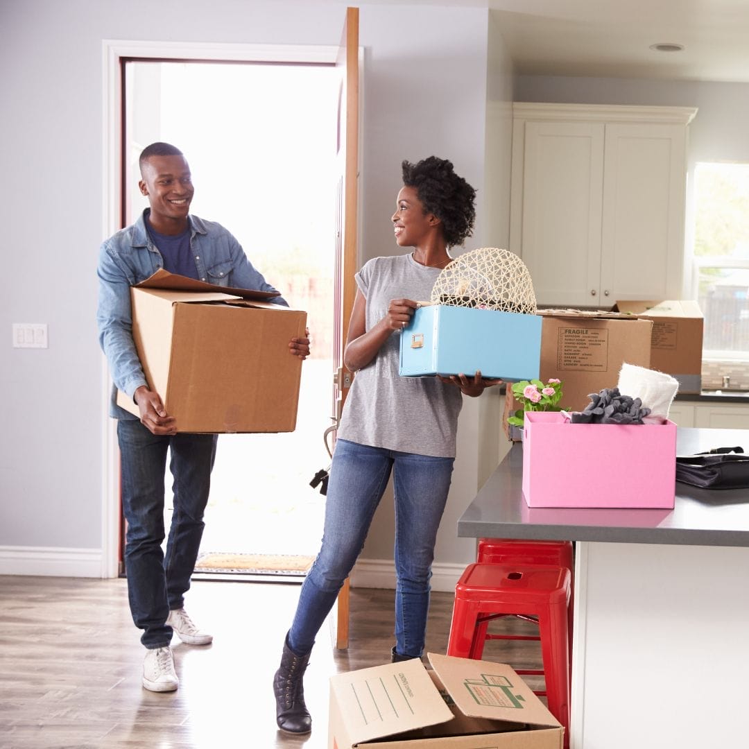 bringing in moving boxes to new apartment